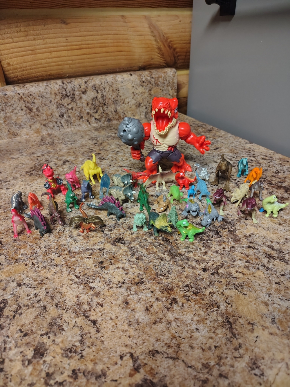Red Dinosaur Action Figure with Assorted Mini Dino Toys